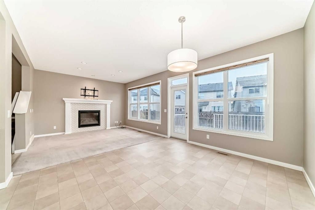 144 Auburn Glen Close Se, Calgary, AB - Indoor Photo Showing Living Room With Fireplace