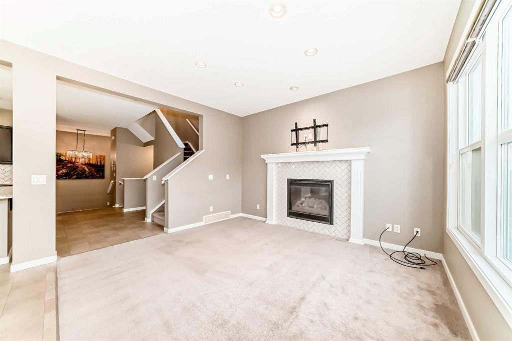 144 Auburn Glen Close Se, Calgary, AB - Indoor Photo Showing Living Room With Fireplace