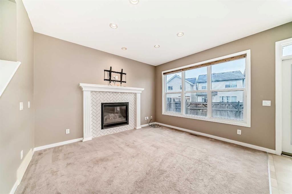 144 Auburn Glen Close Se, Calgary, AB - Indoor Photo Showing Living Room With Fireplace