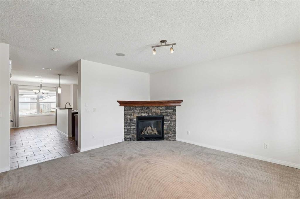 200 Silverado Drive Sw, Calgary, AB - Indoor Photo Showing Living Room With Fireplace