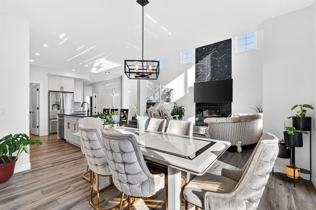 208 Dawson Circle, Chestermere, AB - Indoor Photo Showing Dining Room With Fireplace