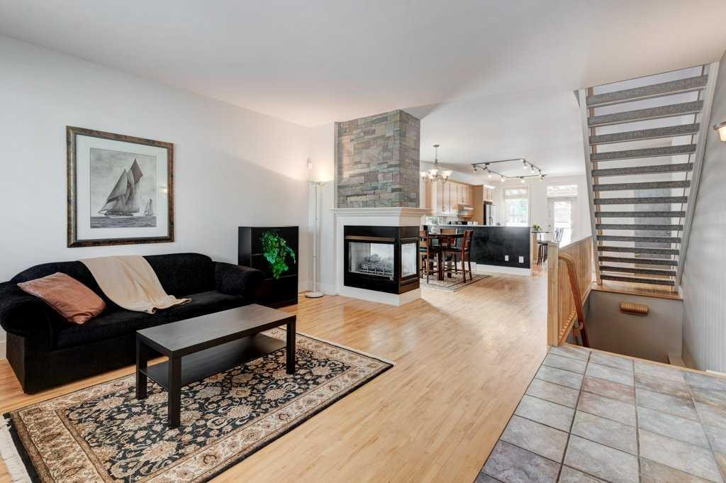 703 52 Avenue Sw, Calgary, AB - Indoor Photo Showing Living Room With Fireplace