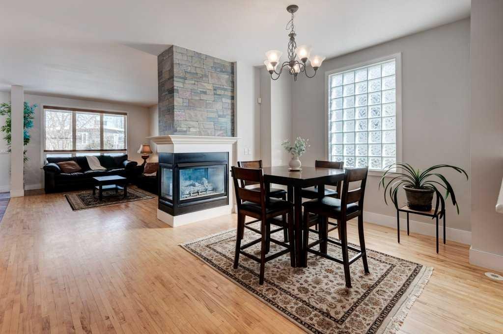 703 52 Avenue Sw, Calgary, AB - Indoor Photo Showing Other Room With Fireplace