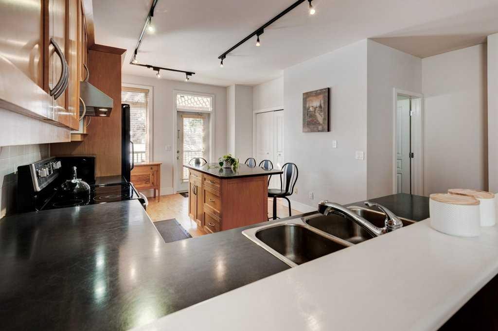 703 52 Avenue Sw, Calgary, AB - Indoor Photo Showing Kitchen With Double Sink