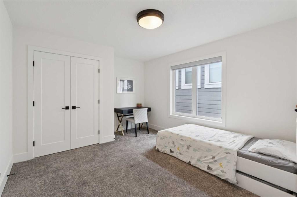 143 Aspen Summit Boulevard Sw, Calgary, AB - Indoor Photo Showing Bedroom