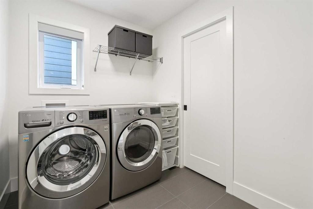 143 Aspen Summit Boulevard Sw, Calgary, AB - Indoor Photo Showing Laundry Room