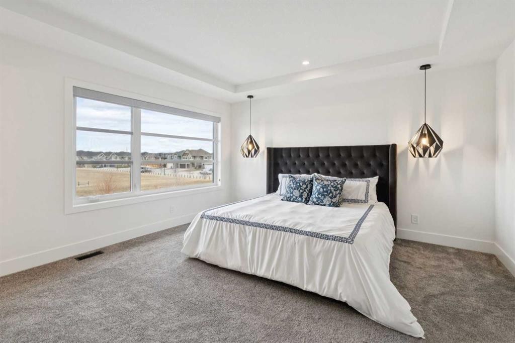 143 Aspen Summit Boulevard Sw, Calgary, AB - Indoor Photo Showing Bedroom
