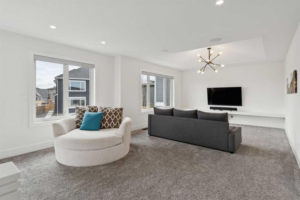 143 Aspen Summit Boulevard Sw, Calgary, AB - Indoor Photo Showing Living Room