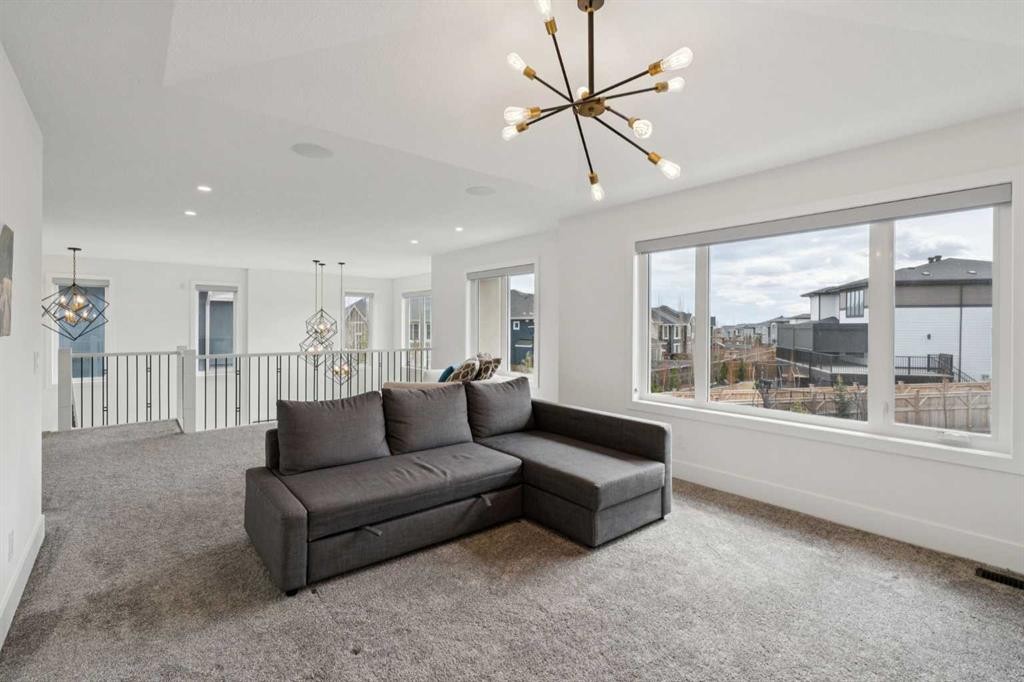 143 Aspen Summit Boulevard Sw, Calgary, AB - Indoor Photo Showing Living Room