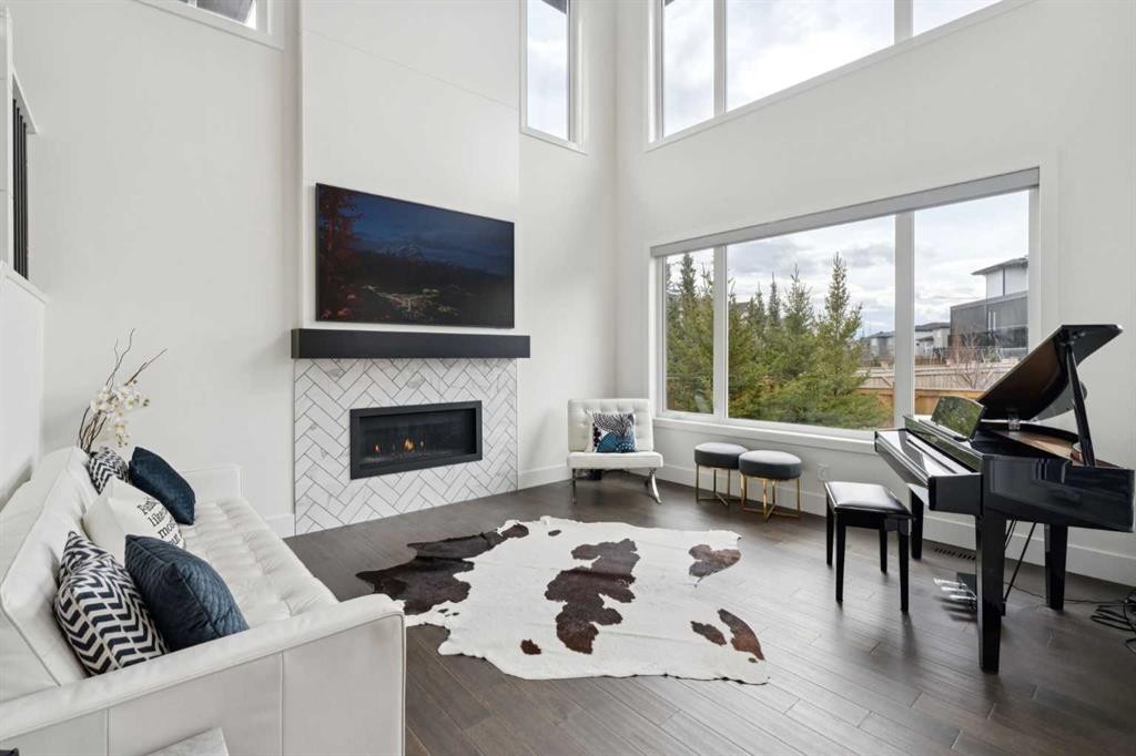 143 Aspen Summit Boulevard Sw, Calgary, AB - Indoor Photo Showing Living Room With Fireplace
