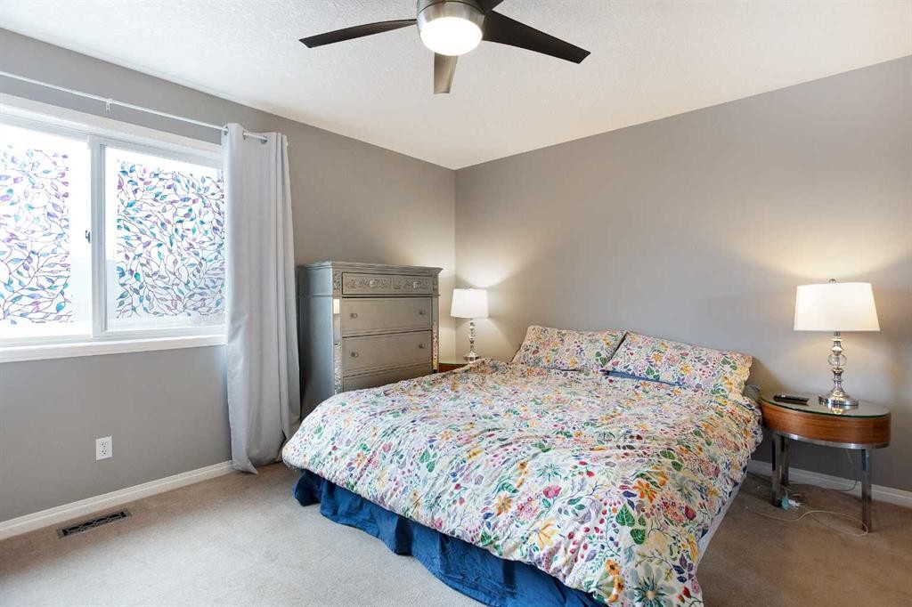 204 Eversyde Circle Sw, Calgary, AB - Indoor Photo Showing Bedroom