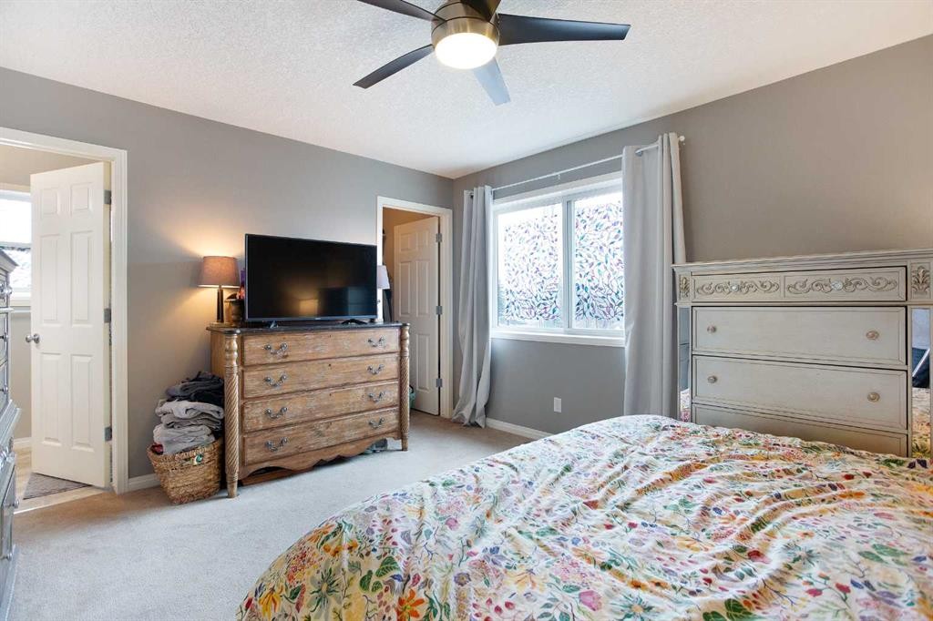 204 Eversyde Circle Sw, Calgary, AB - Indoor Photo Showing Bedroom