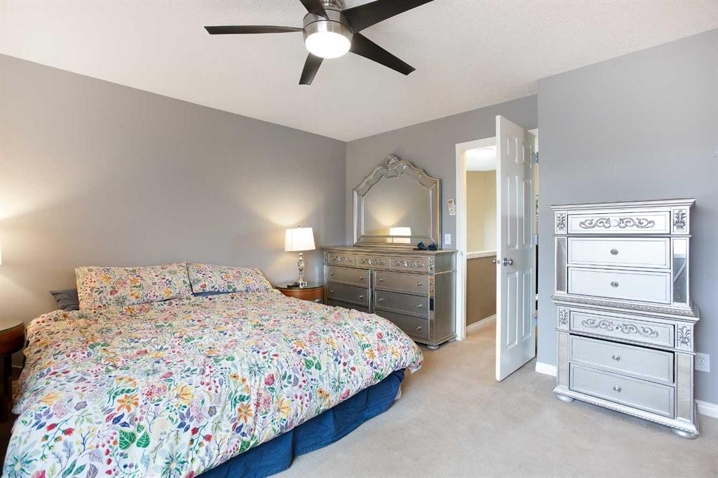 204 Eversyde Circle Sw, Calgary, AB - Indoor Photo Showing Bedroom