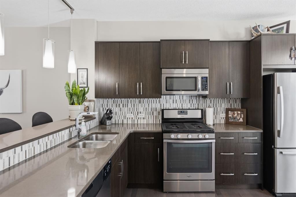 412 Ascot Circle Sw, Calgary, AB - Indoor Photo Showing Kitchen With Stainless Steel Kitchen With Double Sink With Upgraded Kitchen
