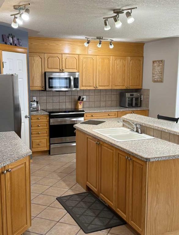 115 Cove Crescent, Chestermere, AB - Indoor Photo Showing Kitchen With Double Sink