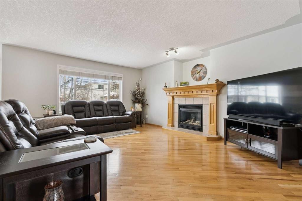 115 Cove Crescent, Chestermere, AB - Indoor Photo Showing Living Room With Fireplace