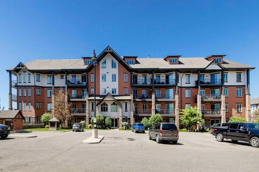 2104-15 Sunset Square, Cochrane, AB - Outdoor With Balcony With Facade