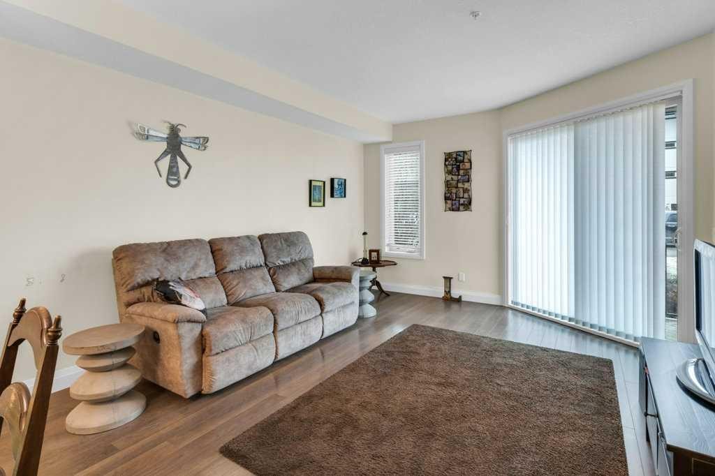 2104-15 Sunset Square, Cochrane, AB - Indoor Photo Showing Living Room