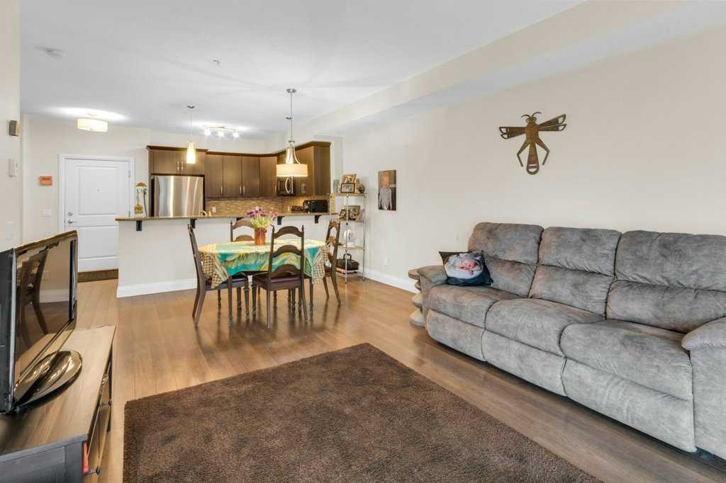 2104-15 Sunset Square, Cochrane, AB - Indoor Photo Showing Living Room
