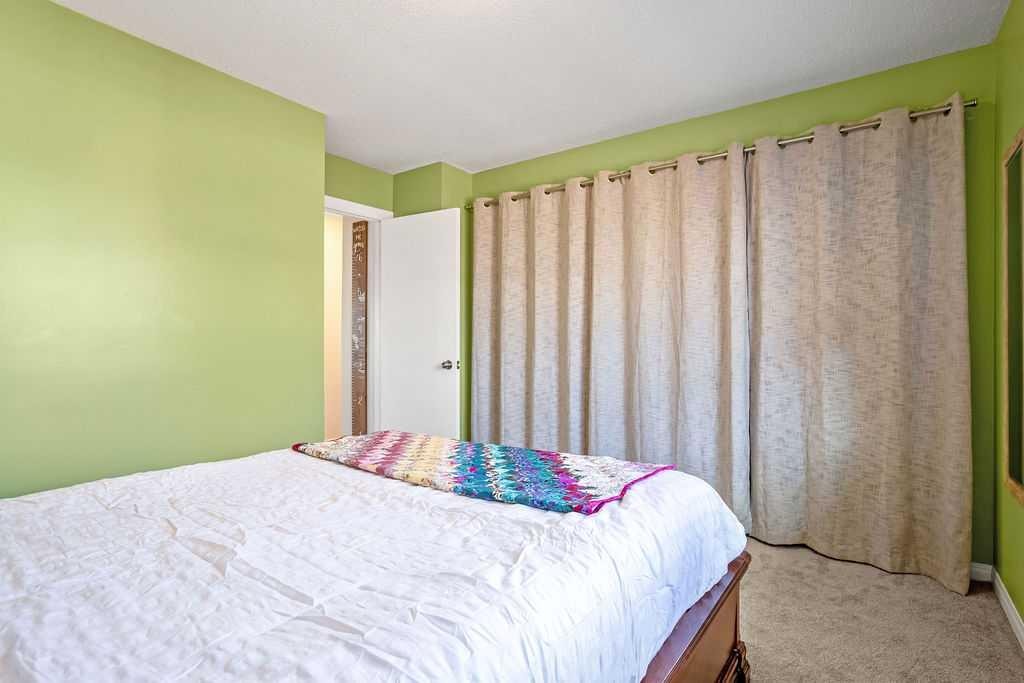 264 Midridge Crescent Se, Calgary, AB - Indoor Photo Showing Bedroom