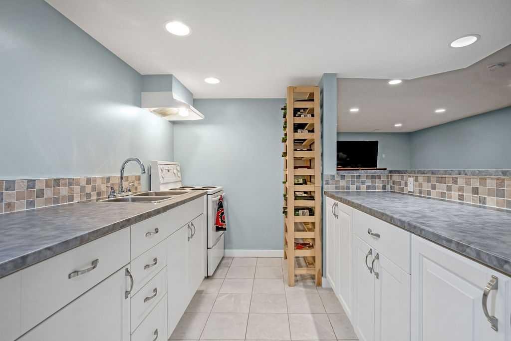 264 Midridge Crescent Se, Calgary, AB - Indoor Photo Showing Kitchen With Double Sink