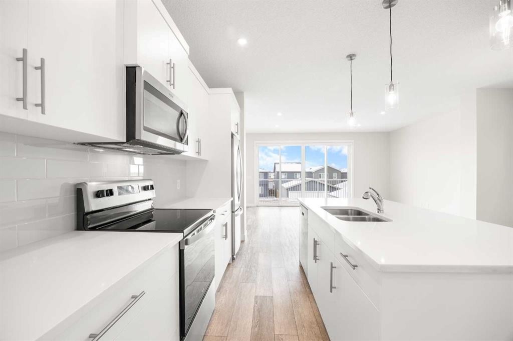 507 Lucas Boulevard Nw, Calgary, AB - Indoor Photo Showing Kitchen With Stainless Steel Kitchen With Double Sink With Upgraded Kitchen