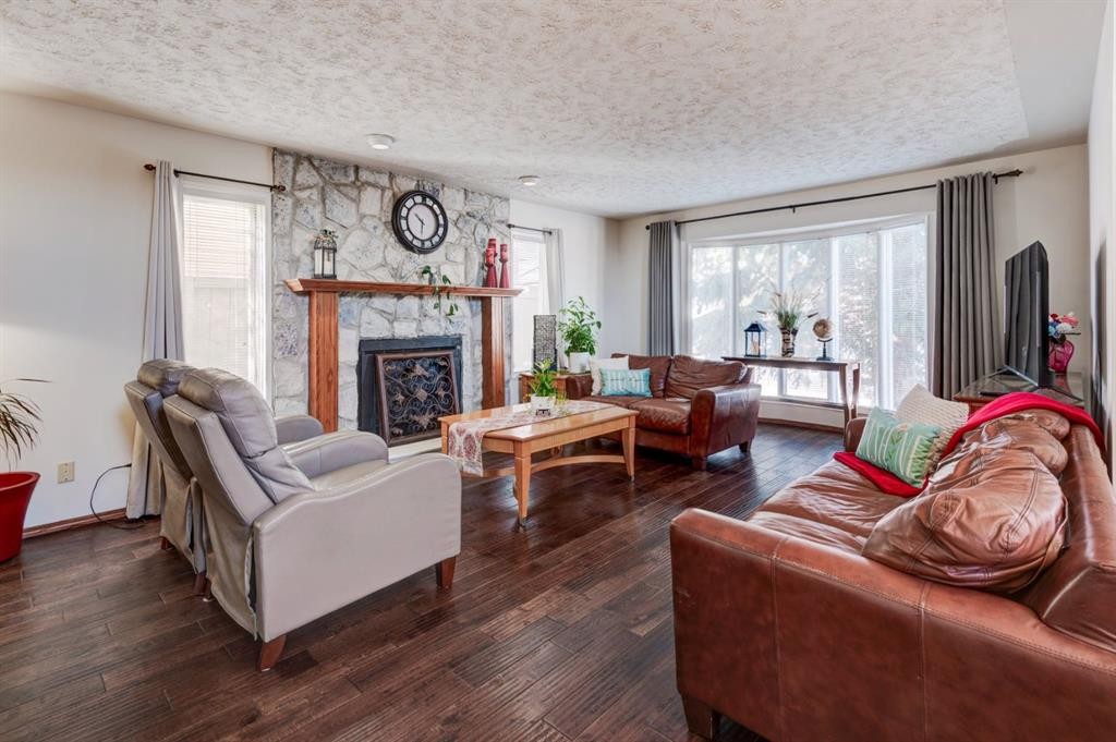 4 Cedargrove Way Sw, Calgary, AB - Indoor Photo Showing Living Room With Fireplace
