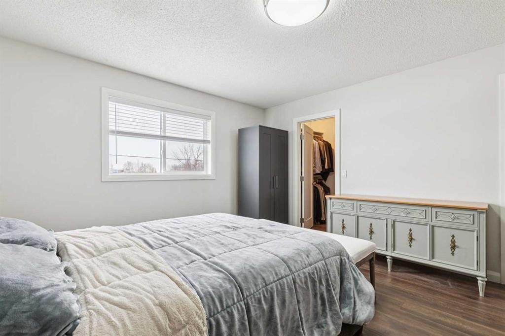 60 Erin Meadow Way Se, Calgary, AB - Indoor Photo Showing Bedroom
