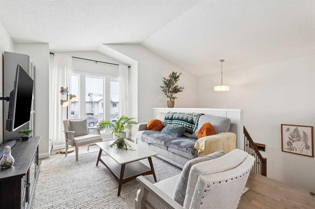 60 Erin Meadow Way Se, Calgary, AB - Indoor Photo Showing Living Room