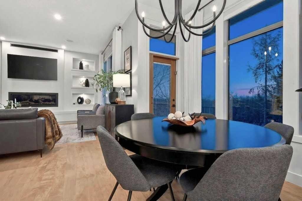 55 Cougar Plateau Circle Sw, Calgary, AB - Indoor Photo Showing Other Room With Fireplace