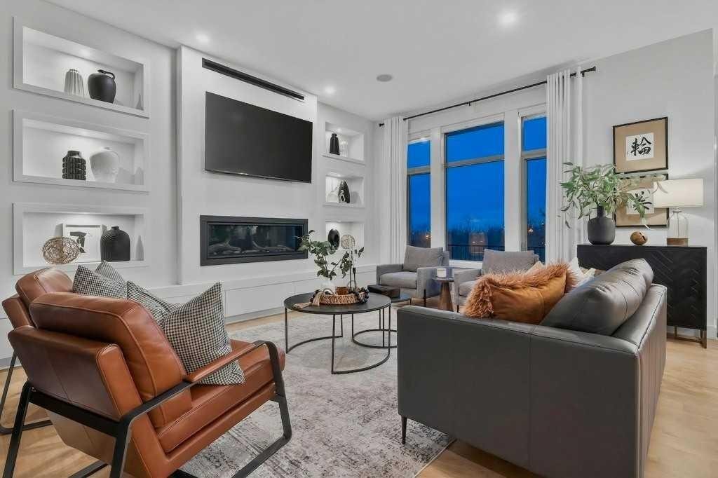 55 Cougar Plateau Circle Sw, Calgary, AB - Indoor Photo Showing Living Room With Fireplace