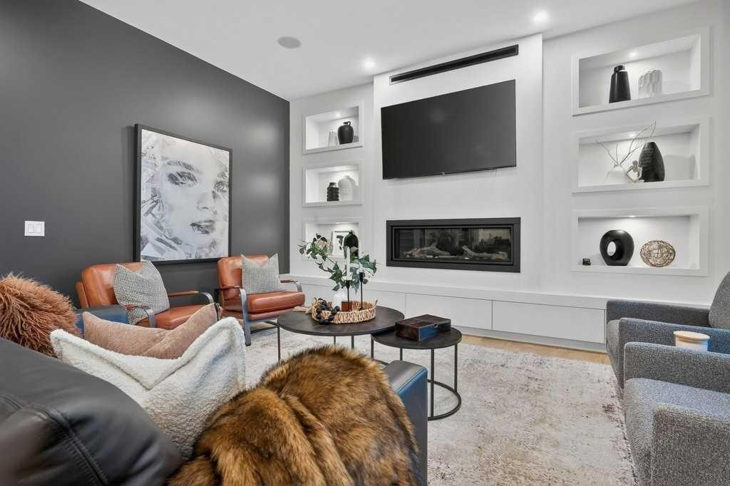 55 Cougar Plateau Circle Sw, Calgary, AB - Indoor Photo Showing Living Room With Fireplace