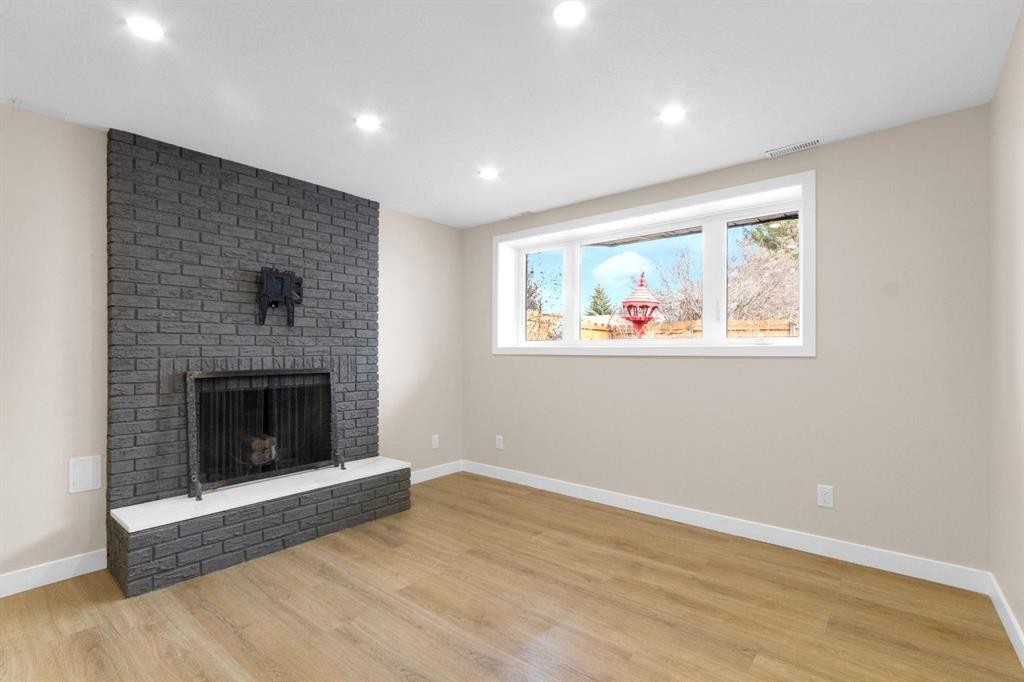 956 Bracewood Rise Sw, Calgary, AB - Indoor Photo Showing Living Room With Fireplace