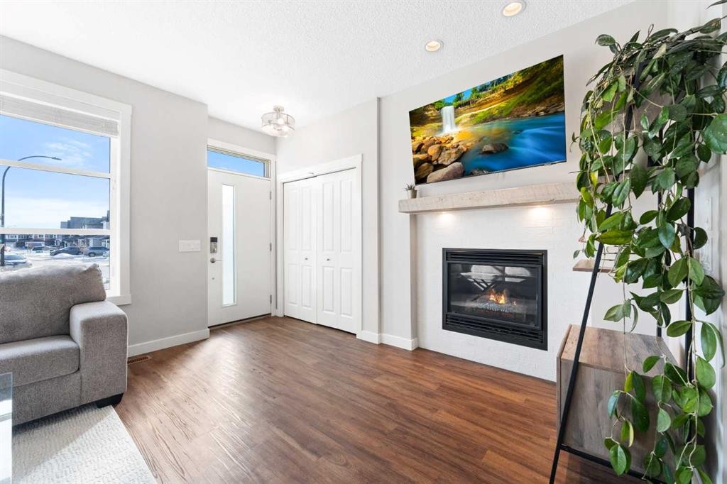 174 Seton Grove Se, Calgary, AB - Indoor Photo Showing Living Room With Fireplace