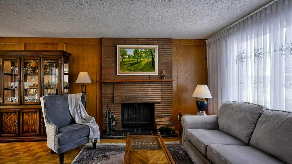 103 Rundlehorn Crescent Ne, Calgary, AB - Indoor Photo Showing Living Room With Fireplace