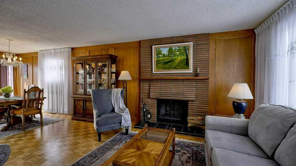 103 Rundlehorn Crescent Ne, Calgary, AB - Indoor Photo Showing Living Room With Fireplace