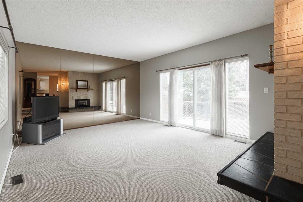 3035 Cedar Ridge Drive Sw, Calgary, AB - Indoor With Fireplace