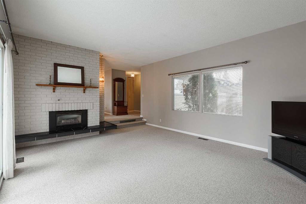 3035 Cedar Ridge Drive Sw, Calgary, AB - Indoor With Fireplace
