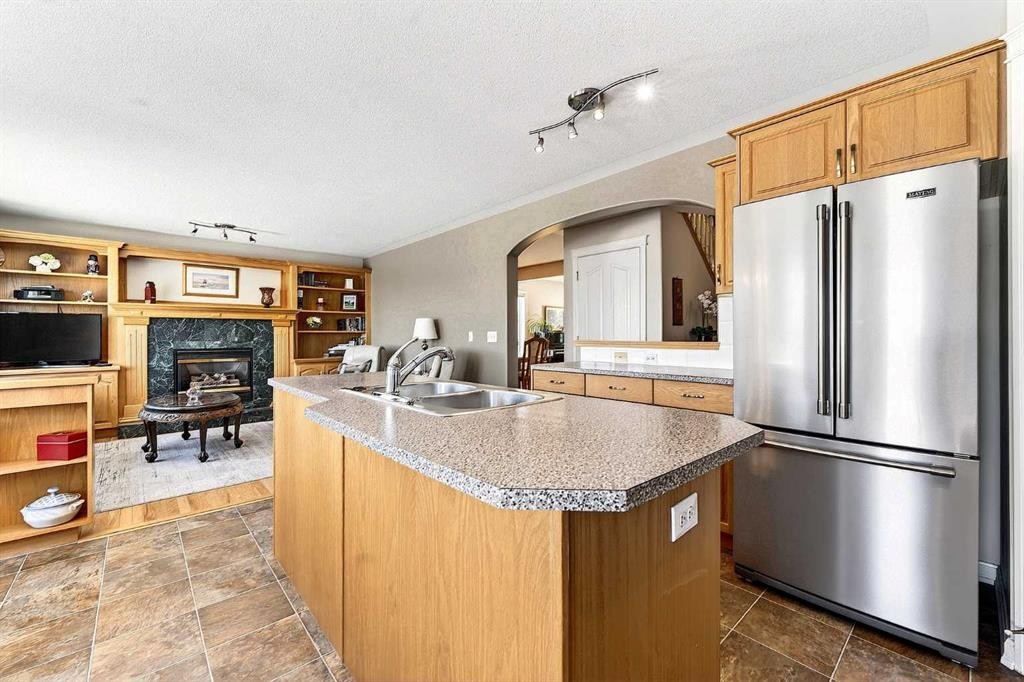219 Hidden Ranch Circle Nw, Calgary, AB - Indoor Photo Showing Kitchen With Stainless Steel Kitchen With Double Sink