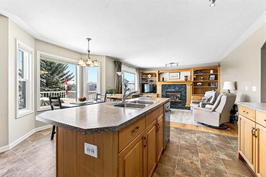 219 Hidden Ranch Circle Nw, Calgary, AB - Indoor With Fireplace
