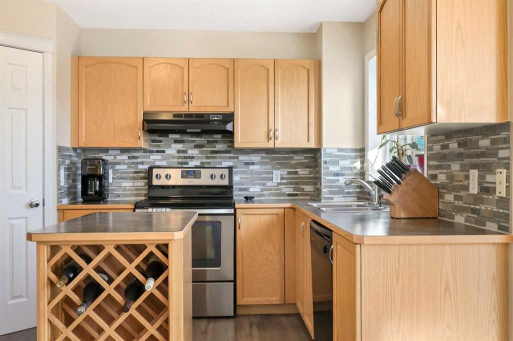 40 Eversyde Circle Sw, Calgary, AB - Indoor Photo Showing Kitchen With Double Sink