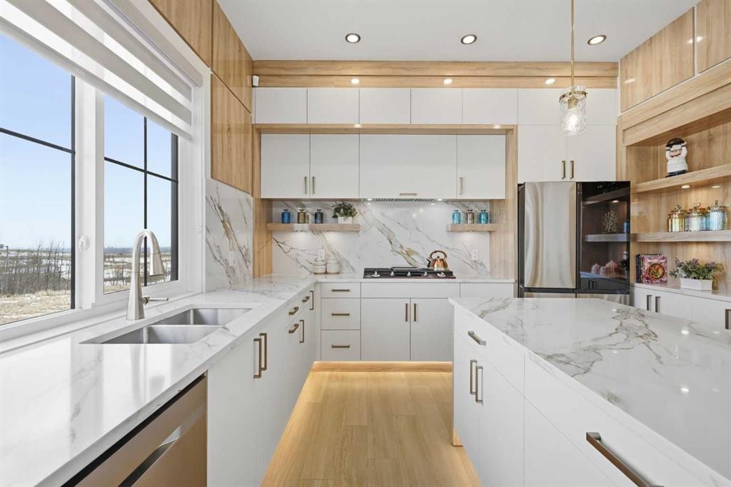230 Royal Birch View Nw, Calgary, AB - Indoor Photo Showing Kitchen With Double Sink With Upgraded Kitchen