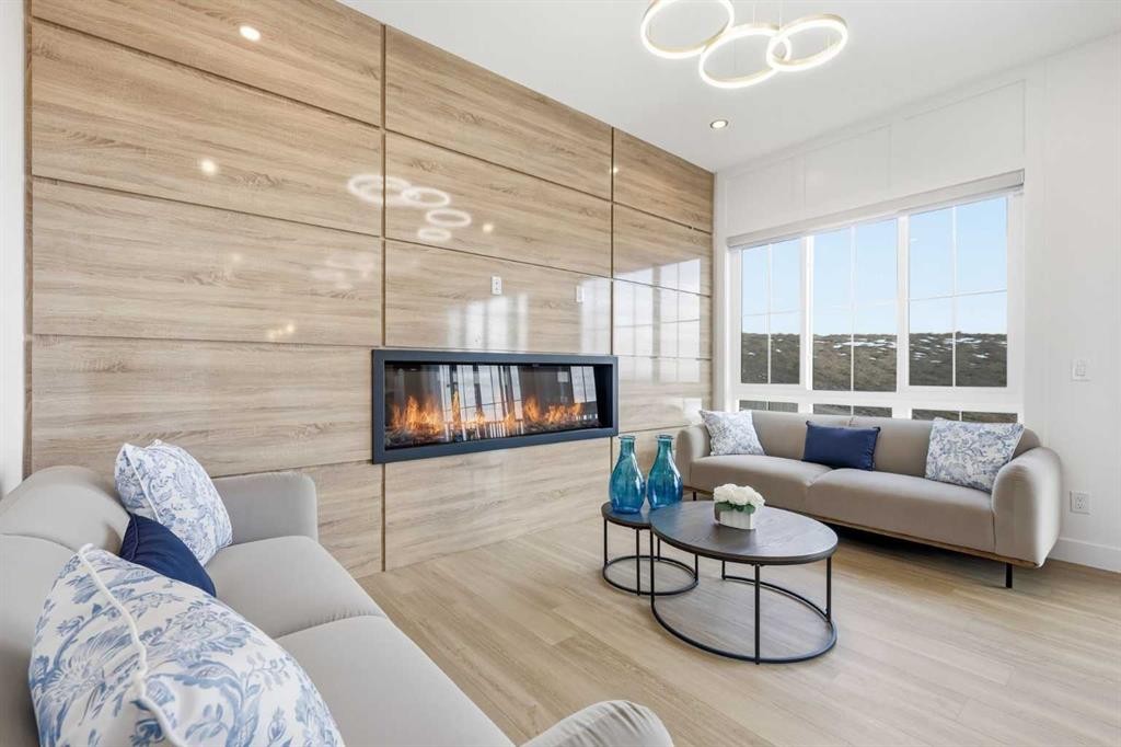 230 Royal Birch View Nw, Calgary, AB - Indoor Photo Showing Living Room With Fireplace