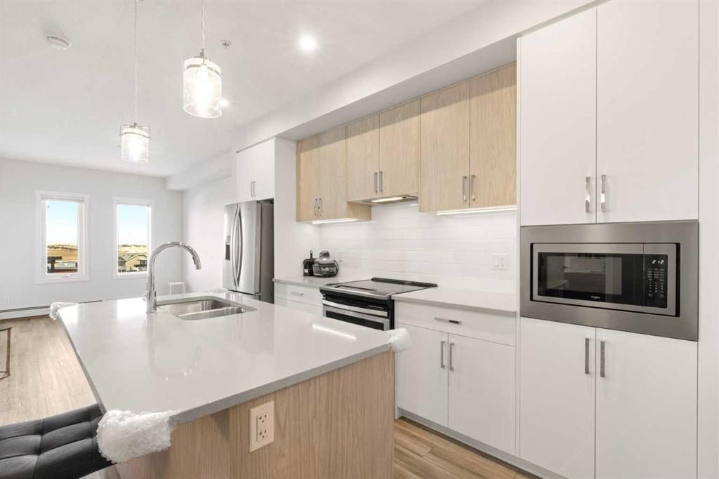 208-138 Sage Valley Common Nw, Calgary, AB - Indoor Photo Showing Kitchen With Double Sink With Upgraded Kitchen