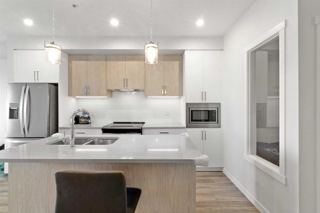 208-138 Sage Valley Common Nw, Calgary, AB - Indoor Photo Showing Kitchen With Stainless Steel Kitchen With Double Sink With Upgraded Kitchen