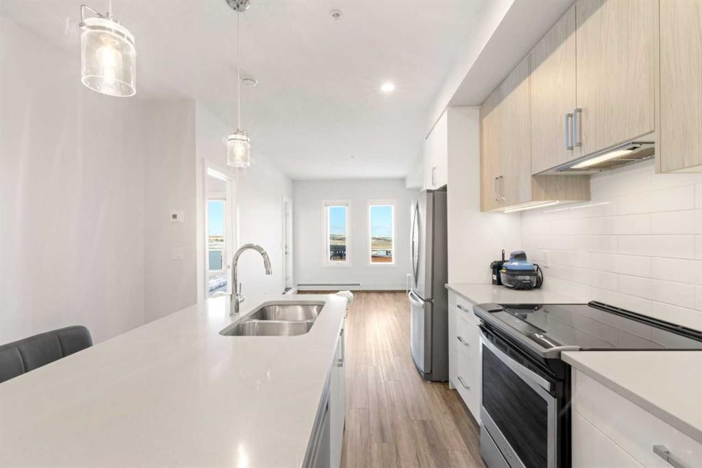 208-138 Sage Valley Common Nw, Calgary, AB - Indoor Photo Showing Kitchen With Stainless Steel Kitchen With Double Sink With Upgraded Kitchen