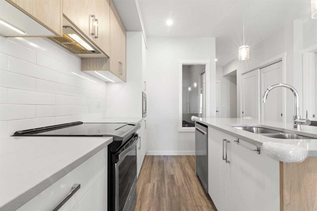 208-138 Sage Valley Common Nw, Calgary, AB - Indoor Photo Showing Kitchen With Double Sink With Upgraded Kitchen