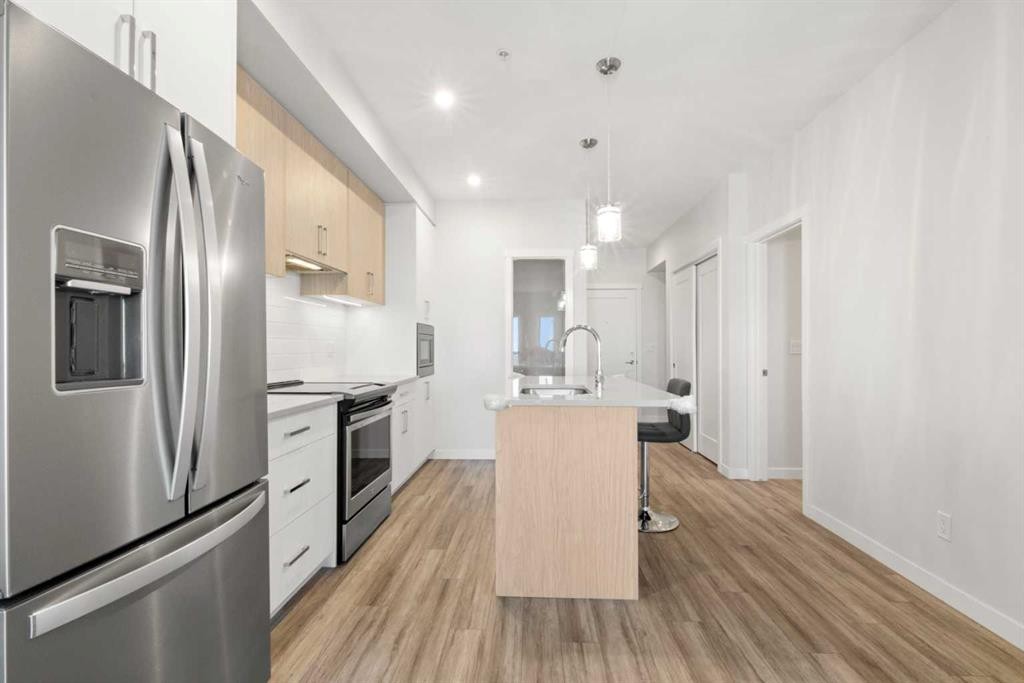 208-138 Sage Valley Common Nw, Calgary, AB - Indoor Photo Showing Kitchen With Stainless Steel Kitchen With Upgraded Kitchen