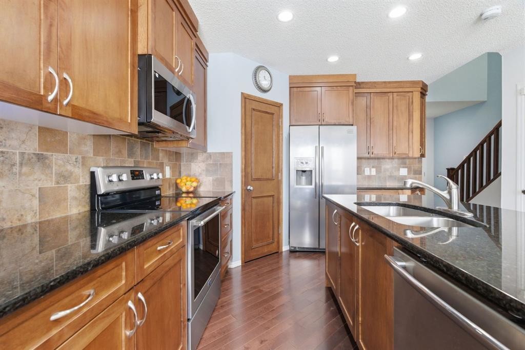 512 Panatella Square Nw, Calgary, AB - Indoor Photo Showing Kitchen With Stainless Steel Kitchen With Double Sink