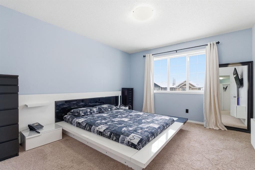 512 Panatella Square Nw, Calgary, AB - Indoor Photo Showing Bedroom